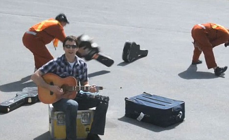 Dave-Carroll-performs-in-the-hit-music-video-United-Breaks-Guitars